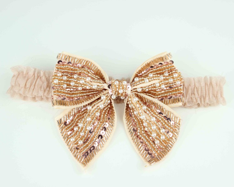 gold-beaded-bridal-garter-bows-2012-wedding-trend.original